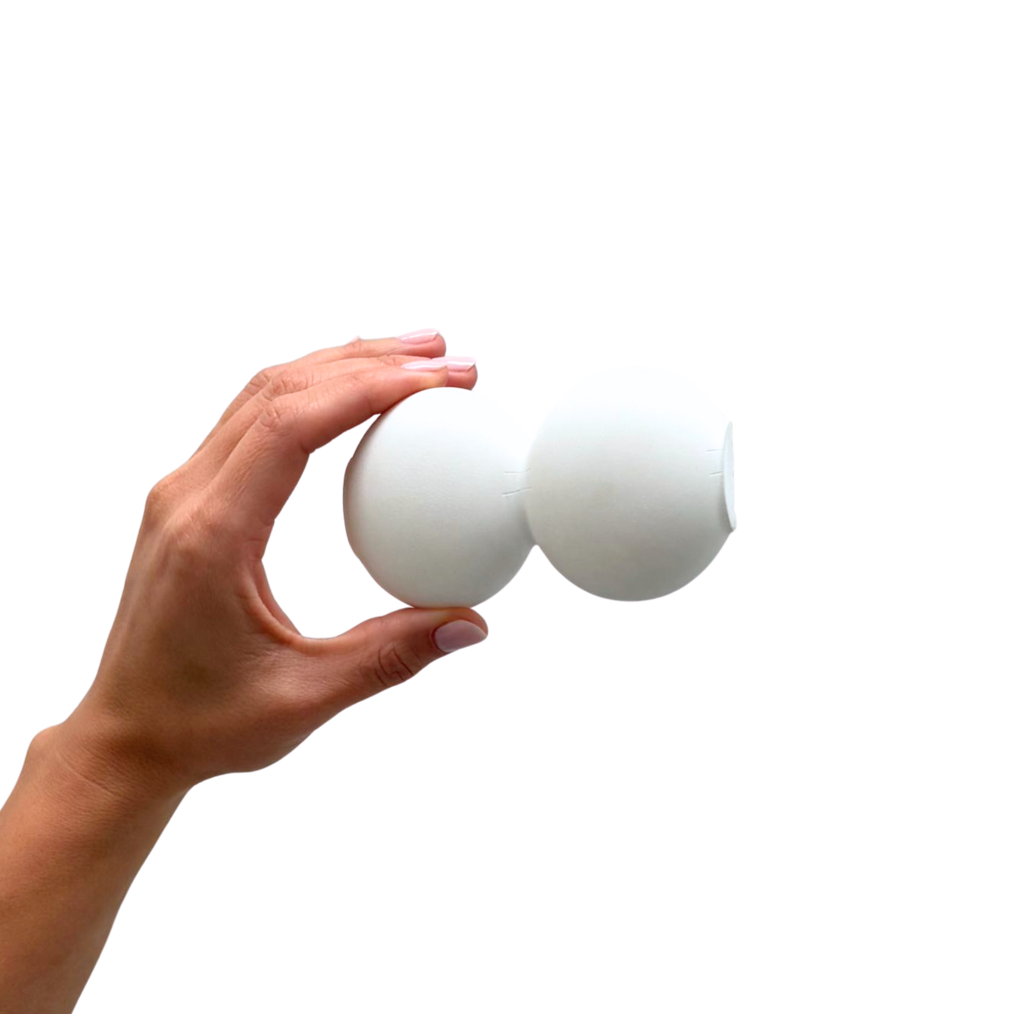 Close-up of a hand holding a white egg from a carton of eggs against a white background.