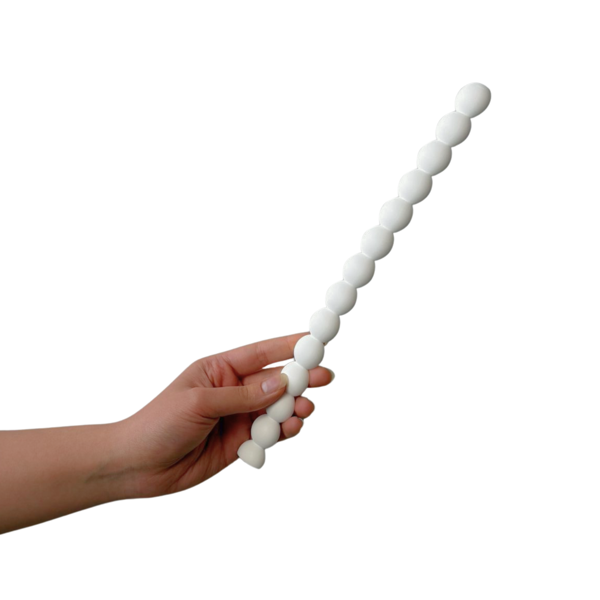 Close-up of a hand holding a string of white round beads against a white background